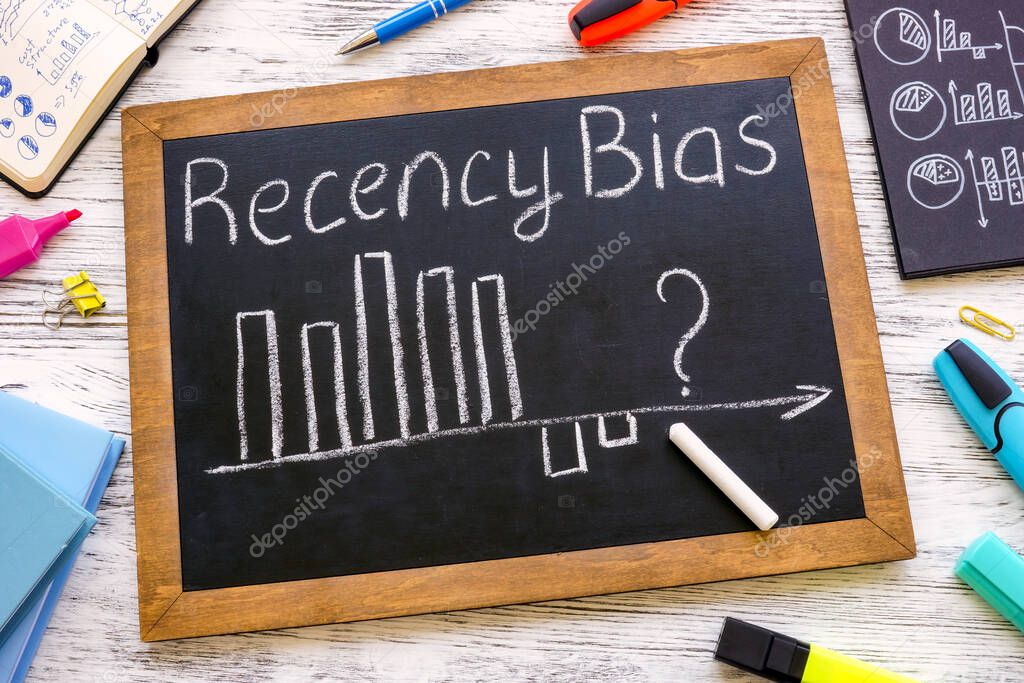 A Small blackboard with chart about recency bias.
