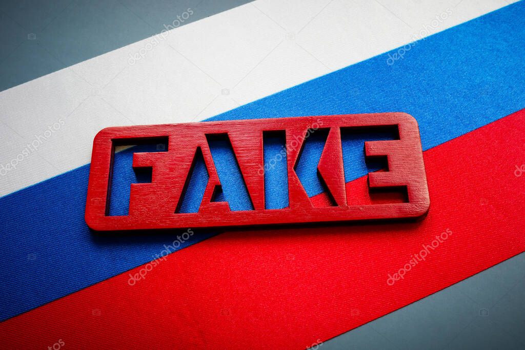 A Russian flag and fake sign. Propaganda concept.
