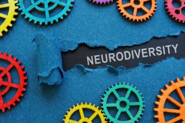 The inscription neurodiversity under the torn paper and colorful gear wheels.