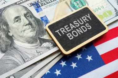 Treasury bonds concept. American flag, dollars and a plate. clipart