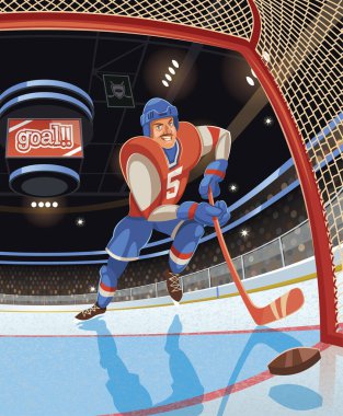 Hokey oyuncusu buz pistinde gol attı.