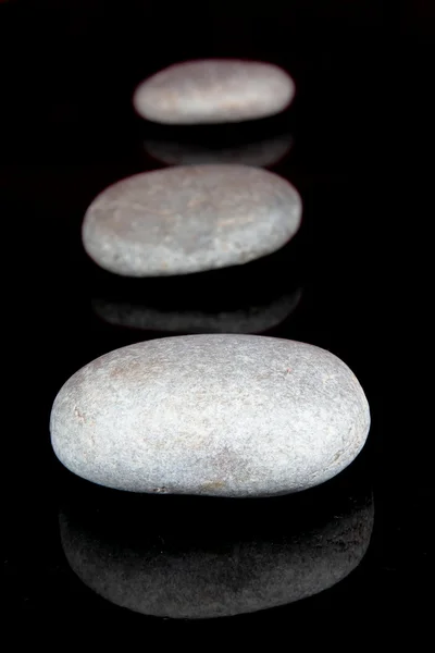 Piedras en fondo negro — Foto de Stock