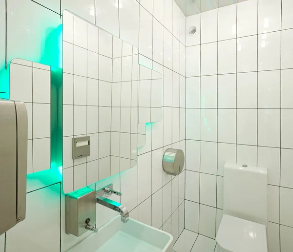 White bathroom with aqua backlight — Stock Photo, Image