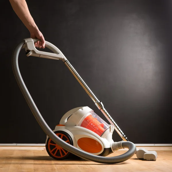 Cleaning with vacuum cleaner in living room — Stock Photo, Image