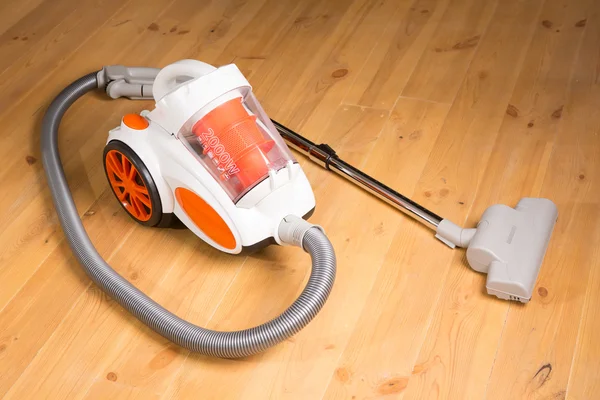 Cleaning of the apartment. Vacuum cleaner on the floor — Stock Photo, Image