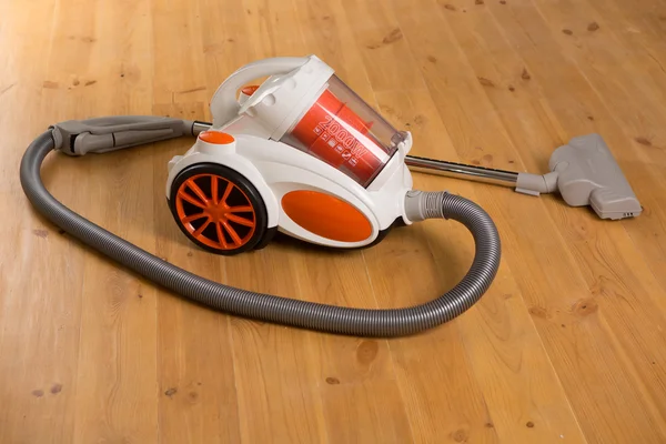 Cleaning of the apartment. Vacuum cleaner on the floor — Stock Photo, Image