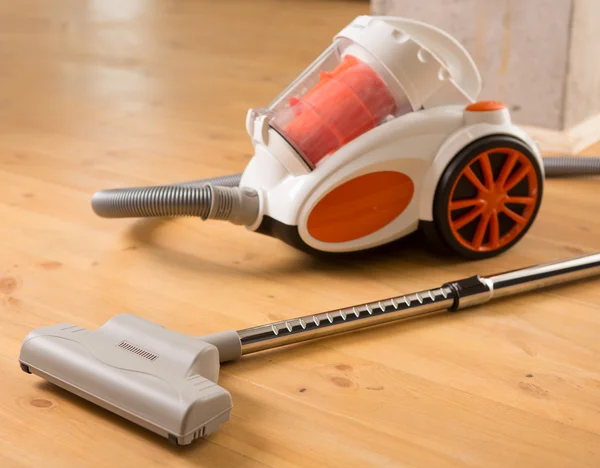 Cleaning of the apartment. Vacuum cleaner on the floor — Stock Photo, Image