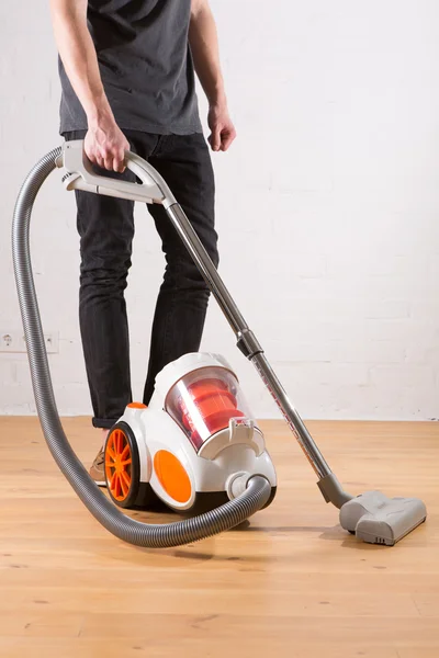 Cleaning with vacuum cleaner in living room — Stock Photo, Image