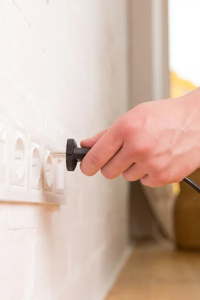 Pull the plug concept with man pulling black cord and plug — Stock Photo, Image