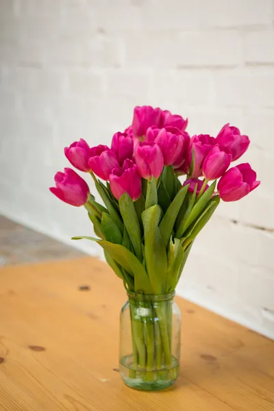 Beautiful pink tulips in a vase — Stock Photo, Image