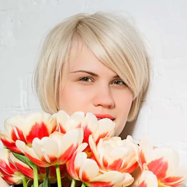 Beautiful woman with a bouquet of roses Stock Photo