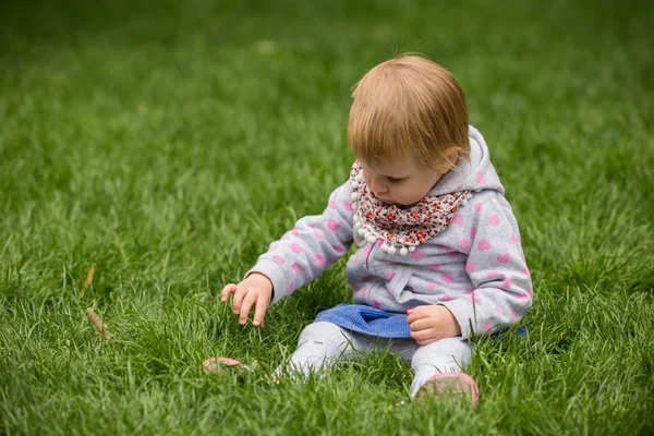 Young adorable cheerful baby playing in park — Stock Photo, Image