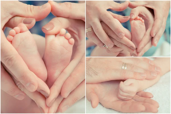 Madre y padre toman la mano del bebé — Foto de Stock