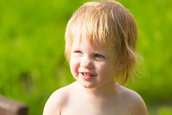 Cute toddler girl in park on summer background. — Stock Photo, Image