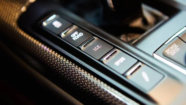 Automatic gear stick of a modern car, multimedia and navigation control buttons. Car interior details. Transmission shift. Shallow dof — Fotografia de Stock