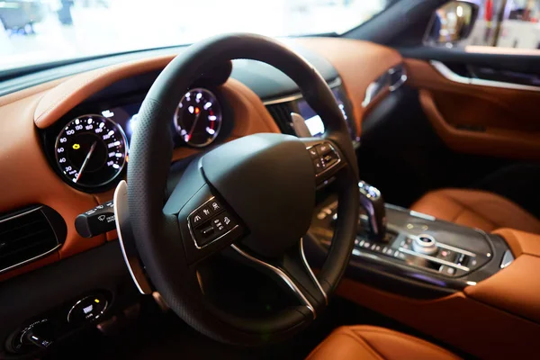 Car inside driver place. Interior of prestige modern car. Steering wheel, dashboard, display. Luxury car interior — Stock fotografie