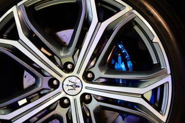 Ukraine, Kyiv - October 10, 2021: Closeup wheel with blue brake discs. Presentation of new models Maserati