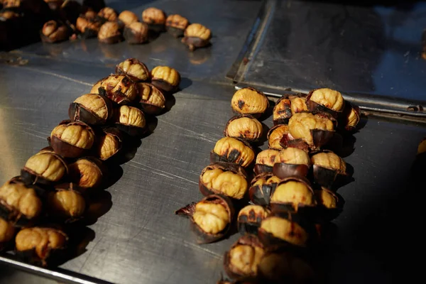 Roasted chestnuts sold at street. — Photo