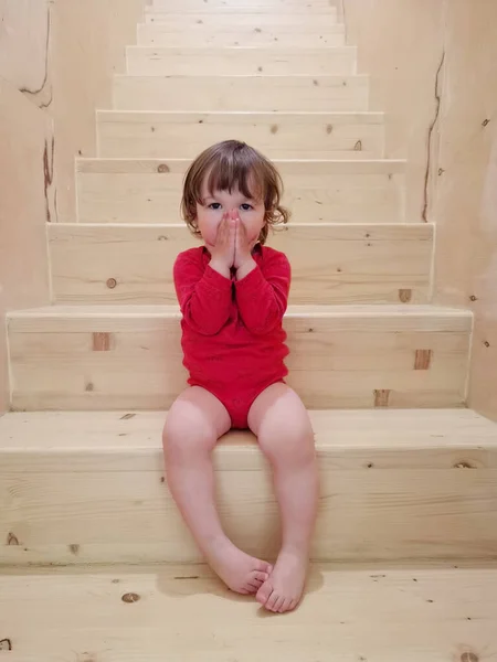 Funny Toddler Baby Girl Red Body Sits Stairs Indoors — Stock Photo, Image