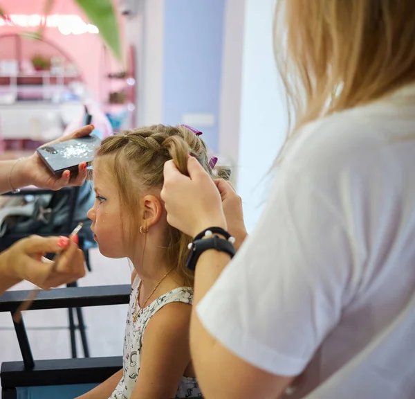 Children make up. Glitter makeup. Sparkles on cheek