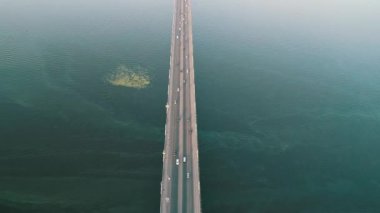 Aerial top view of bridge road automobile traffic of many cars, transportation concept. Kyiv, Ukraine.