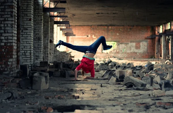 Teenager dancing in the old brickworks — Stock Photo, Image