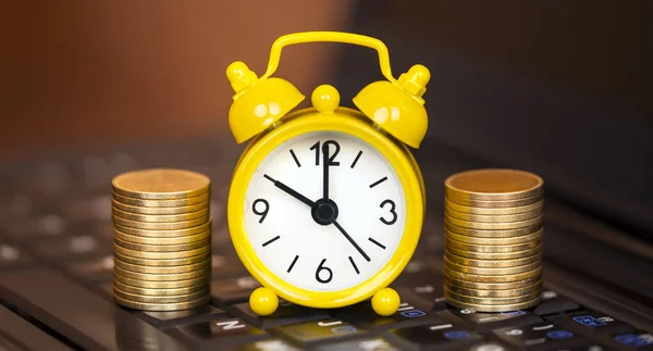 Alarm clock and gold money coins, financial planning banner