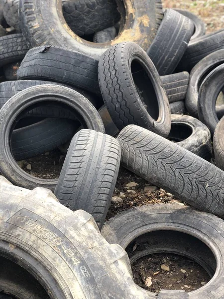 Black used Tires. Car Tyres Pattern on the Ground.