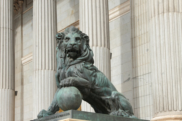 Sculpture of lion at an entrance to Congress of deputies. Madrid, Spain