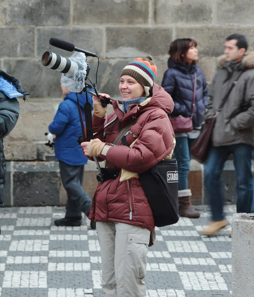 Joyful girl with equipment for video filming by camera Stock Photo