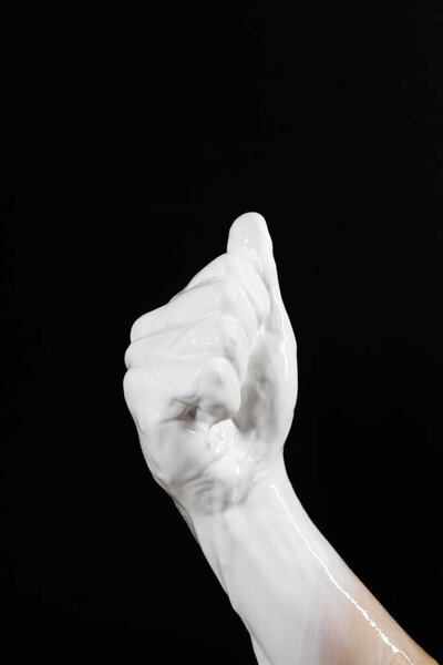 a clenched fist on a black background