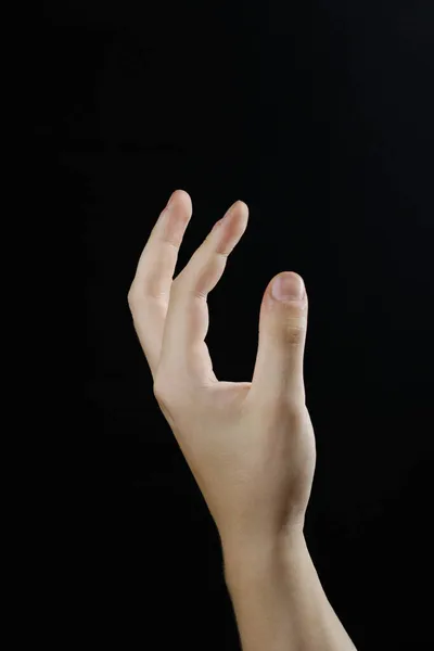 Siyah bir arkaplanda güzel bir el dönüşü.