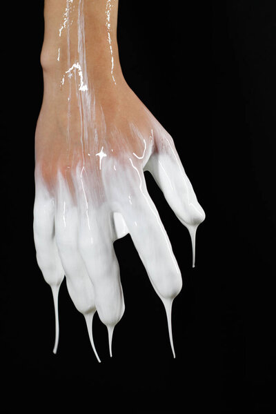 the hand doused with liquid is turned with the back side