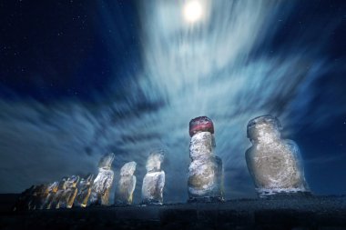 Easter Island statues at moonlight clipart