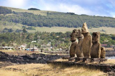 Five standing moais on shore in Hangaroa in Easter Island clipart