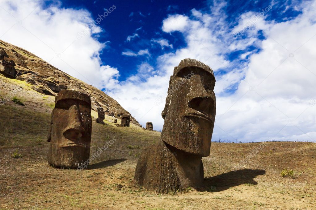 Heads of buried moais standing on a mountain in Easter Island
