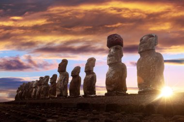 Standing moai in Easter Island at sunrise clipart