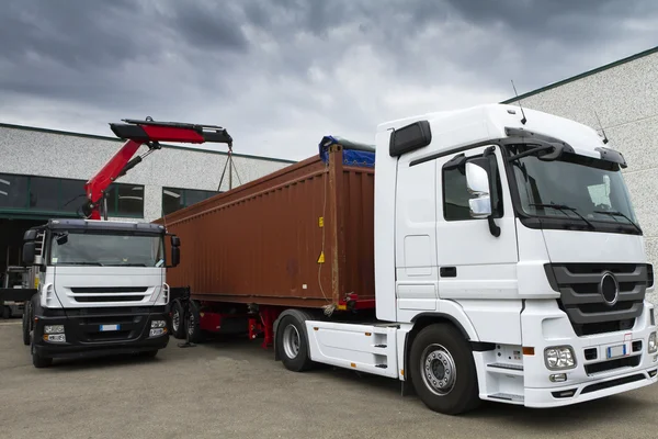 Crane, trucks and container — Stock Photo, Image