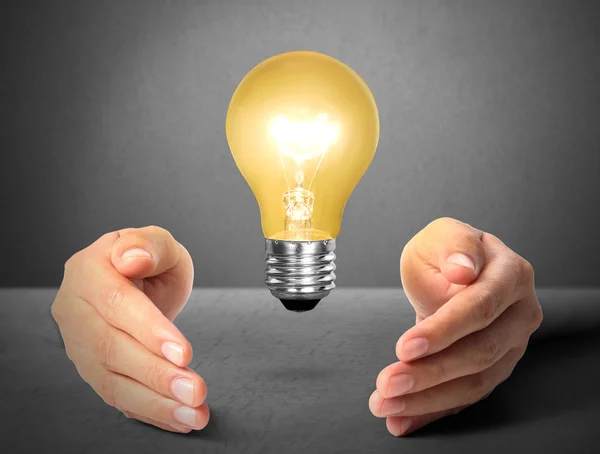 Ideas light bulb in hand — Stock Photo, Image