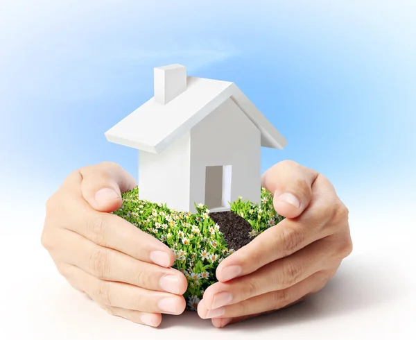 Holding house in hand — Stock Photo, Image