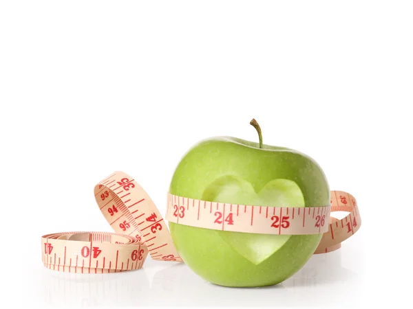 Green apples measured the meter on white — Stockfoto