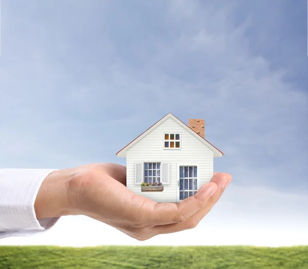 Holding house representing home ownership — Stock Photo, Image