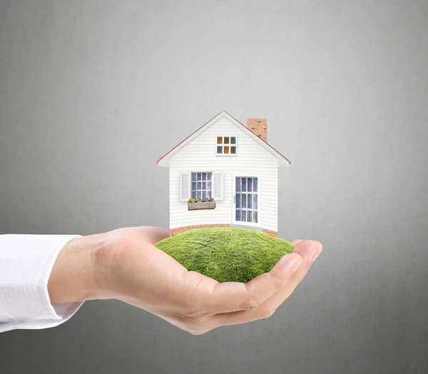 Holding house representing home ownership — Stock Photo, Image