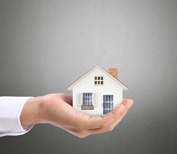 Holding house representing home ownership — Stock Photo, Image