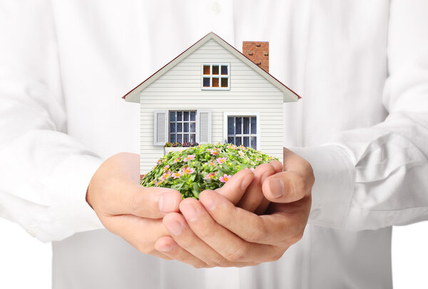 holding house representing home 