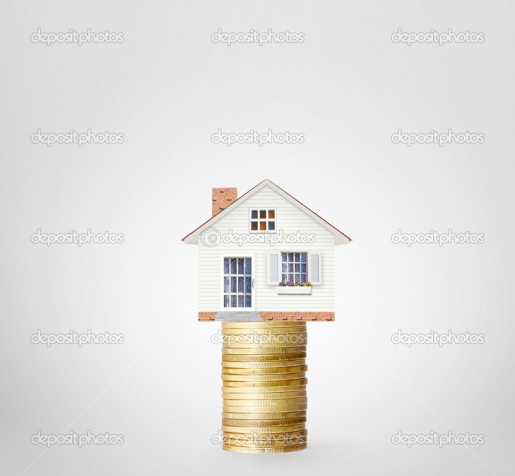 Mortgage concept by money house from  coins 
