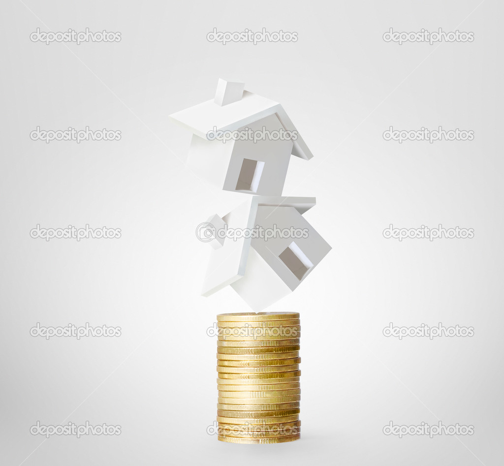 Mortgage concept by money house from  coins 