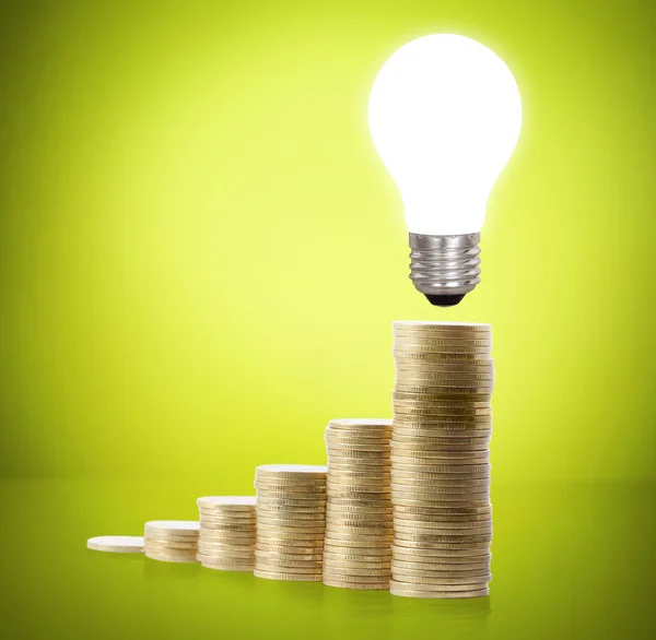 Money saved in different kinds of light bulbs — Stock Photo, Image