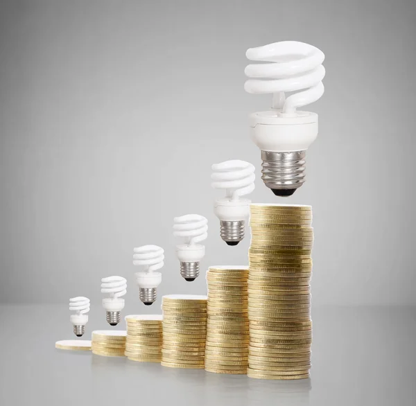 Money saved in different kinds of light bulbs — Stock Photo, Image