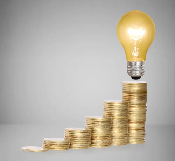 Money saved in different kinds of light bulbs — Stock Photo, Image